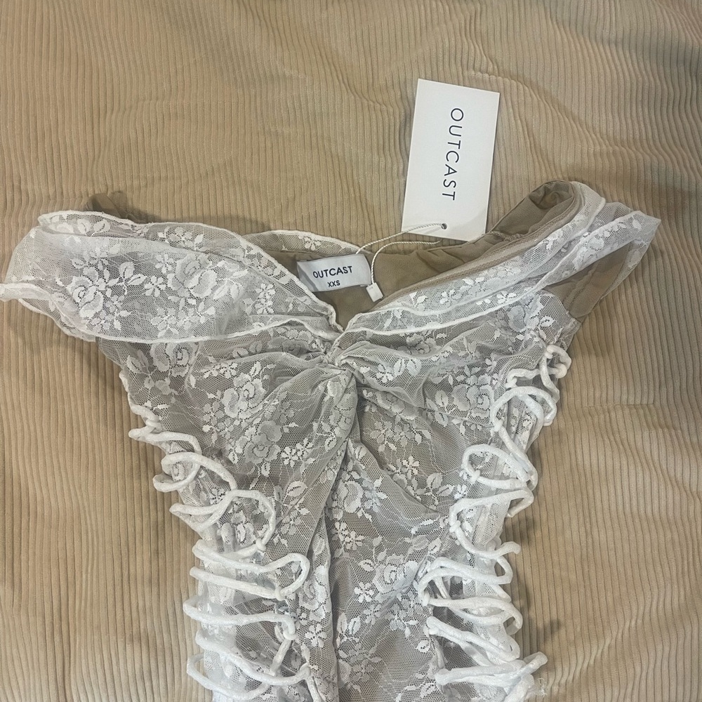 Brand new outcast top